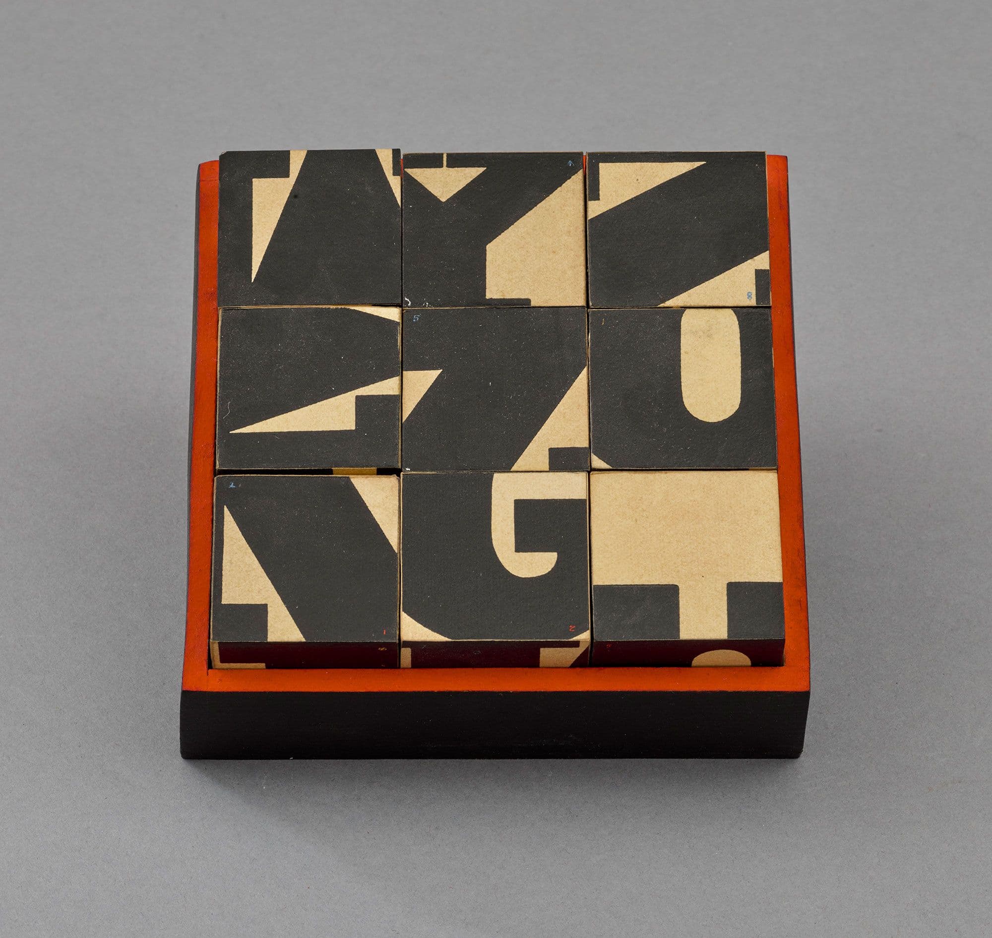 Norman Ives American, 1923-1978 Letter Blocks, c. 1960 Wood, paint, 1 1/8 x 5 3/8 x 5 3/8 in. (3.2 x 13.7 x 13.7 cm), height x length x width