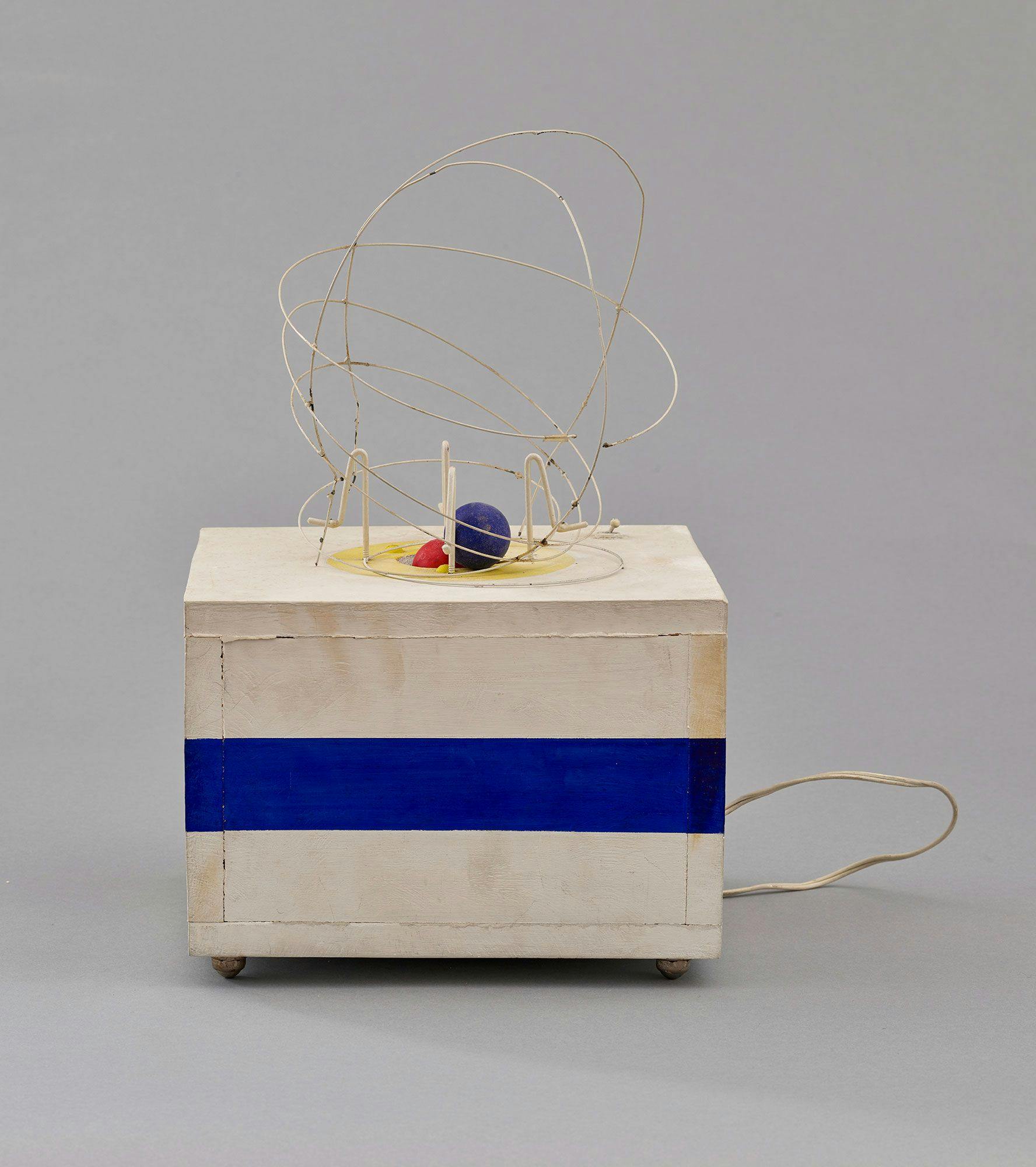 Enrique Castro-Cid Chilean, 1937-1992 Red and Blue Machine, 1964 Painted wood, wire, ping-pong balls, and electric motor, 19 3/4 in. (50.2 cm), overall height